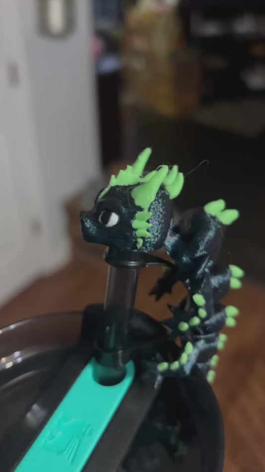 Green and black dragon straw topper